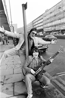00502 Prints: Guitarist Gerry Cott (standing) and bass player Peter Briquette from the Boomtown Rats