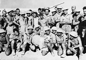 North Africa Prints: Gunners in Tobruk, Libya. (Picture) These gunners have as their mascot a Libyan