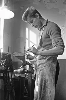 Gunsmith making a stock for a shotgun in Birminghams Gun Quarter. Circa 1973