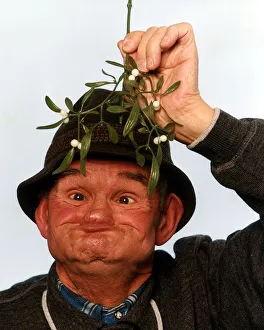 Gurning Man Under Mistletow December 1993 A&copy;Mirrorpix Local Caption