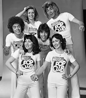 Guys N Dolls pop group wearing Daily Mirror Pop Club T-shirts 29th January 1976