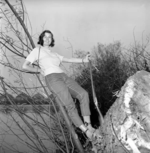 00845 Prints: Gwendolen Tulley poses with her rifle as she enjoys a shooting holiday, 1956