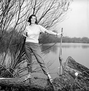00845 Prints: Gwendolen Tulley poses with her rifle as she enjoys a shooting holiday, 1956
