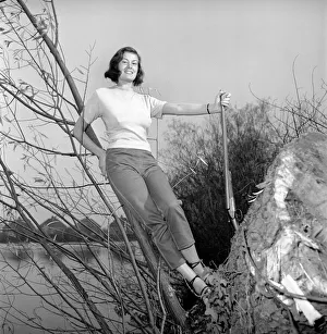 00845 Prints: Gwendolen Tulley poses with her rifle as she enjoys a shooting holiday, 1956