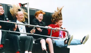 Fairground Prints: A hair raising experience for youngsters on one of the rides at a fair in the north east