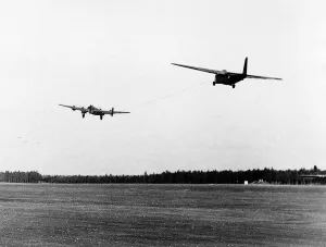 Halifax bomber towing a glider takes off from English airfield as part of the Allied