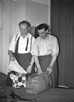 00351 Prints: Two Halifax players unpacking on arrival at their hotel on the eve of the Rugby League