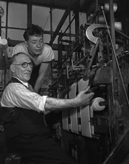 Skill Prints: A handframe knitter seen here with his apprentice at The Shawl Factory of GH Hurt