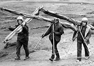 Images Dated 1st March 1975: These hang gliders have a long hard trek back up the hill to start again in March 1975