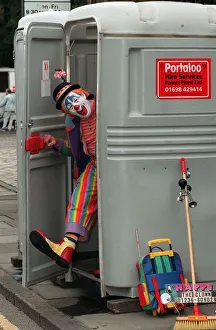 00182 Prints: Happi the clown (Ronald Williams) at Edinburgh Festival Cavalcade August 1999 in portaloo