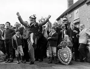 Cheering Prints: Happy days for Alvechurch fans. Mascot Tom Borrows leads the celebrations outside