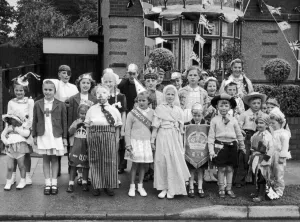Bunting Prints: Happy and glorious; Children in fancy dress for a 1953 Coronation party in Arlon Avenue