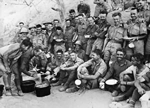 East Africa Prints: A happy group of British soldiers awaiting their turn for food at a meal parade in