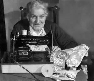 00355 Prints: A very happy Mrs. Emms with her new Singer Sewing machine presented to her by the Daily