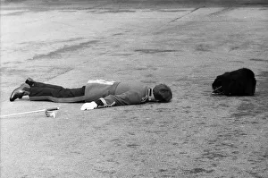 Guard Prints: A hard days work for actor Richard Warwick who is playing Bumbo Bailey in the film