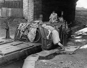 Gates Prints: Hard Realities: Its a man-sized job shifting a huge timbered canal narrow boat