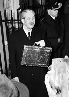 Harold MacMillan Chancellor of the Exchequer leaving Number 11 Downing Street with