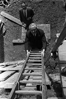 Ladders Prints: Harold Wilson climbs a builders ladder during a visit to Toynbee Hall in the procsess