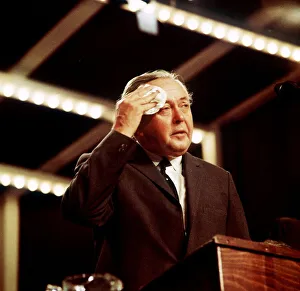 Harold Wilson seen here wiping his brow whilst delivering his speech to conference