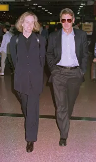 Hands In Pockets Prints: Harrison Ford and his wife Melissa Matheson leave Heathrow for New York on Concorde ***