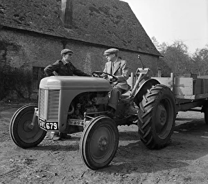 Landscape Prints: Harry Ferguson The designer of the Ferguson Tractor driving a tractor with trailer