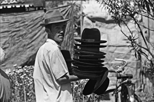 Asia Prints: Hat seller at the flower market in Saigon on the eve of the Tet celebrations