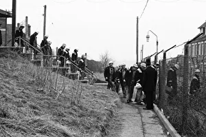 Strike Prints: Having changed their clothes, working miners leave the changing room