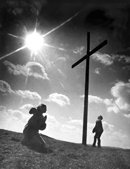00083 Prints: Someone having a silent prayer before the cross on top of Tunstall Hill in Sunderland