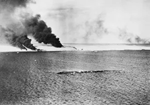 Smoke Prints: Havoc at Tobruk. Aerial view of Tobruk with sunken cargo vessel in the foreground