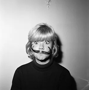 Hayley Mills wearing a genuine Dali imitation moustache, which can be bought for 12s. 6d