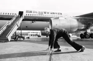 Head of Laker Airways Freddie Laker in jubilant mood on the runway at Gatwick airport