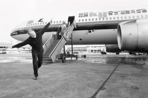 Head of Laker Airways Freddie Laker in jubilant mood on the runway at Gatwick airport