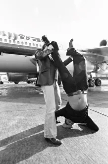 Head of Laker Airways Freddie Laker in jubilant mood on the runway at Gatwick airport