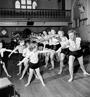 Keep Fit Prints: Health and Beauty: Wimbledon mothers and their children keep fit at the local church hall