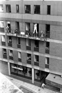 Health And Safety Prints: No health and safety here as this painter stands precariously on top of the hand rails of