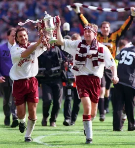 Hearts Prints: Heart of Midlothian footballer Jim Hamilton carries the Scottish Cup trophy around Celtic