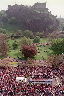 Heart of Midlothian footballers are cheered by fans as they celebrate with the Scottish
