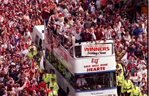 Team Prints: Heart of Midlothian footballers are cheered by fans as they celebrate with the Scottish