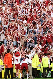 Hearts Prints: Heart of Midlothian footballers show off the Scottish Cup trophy to jubilant fans on a
