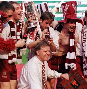 Success Prints: Heart of Midlothian manager Jim Jefferies and players celebrate with the Scottish Cup