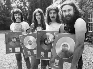Heavy Metal group Black Sabbath pictured with the silver discs they received for