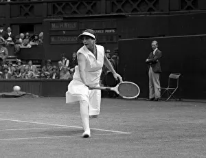 Racket Prints: Helen Wills at the Wimbledon tennis championships returning a backhand shot July