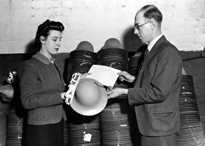 00105 Prints: These helmets were worn by Fire watchers and were probably made by Tuck & Blakemore Ltd