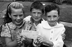Money Prints: Helping other children... these three Highburton youngsters decided to raise some charity