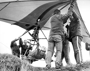 00104 Prints: Helping hands get Gordon Smith ready to take to the air in his Hang Glider in April 1978