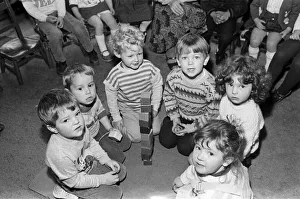 Huddersfield0586 Prints: Helping raise money for new toys at their playgroup are three-year-old Simon Gerrard