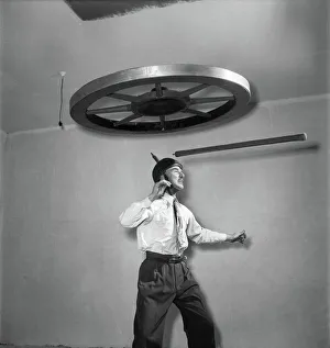 Henri Vadden holds an 80lb cartwheel on a pole which he then places on his chin