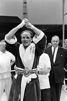 Heavyweight Prints: Henry Cooper receiving the Lonsdale belt after his win in the fight against Jack Bodell