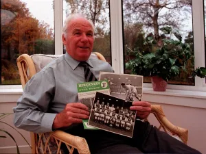 00270 Prints: Hibernian football legend Lawrie Reilly at home with mememtoes of his playing career