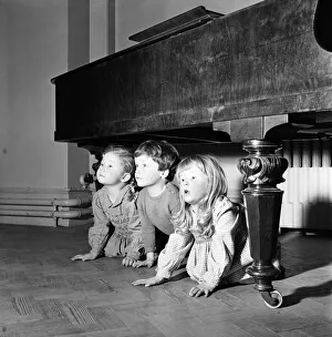 00021 Prints: Hide and Seek. Infant schoolchildren playing during a dance and movement class